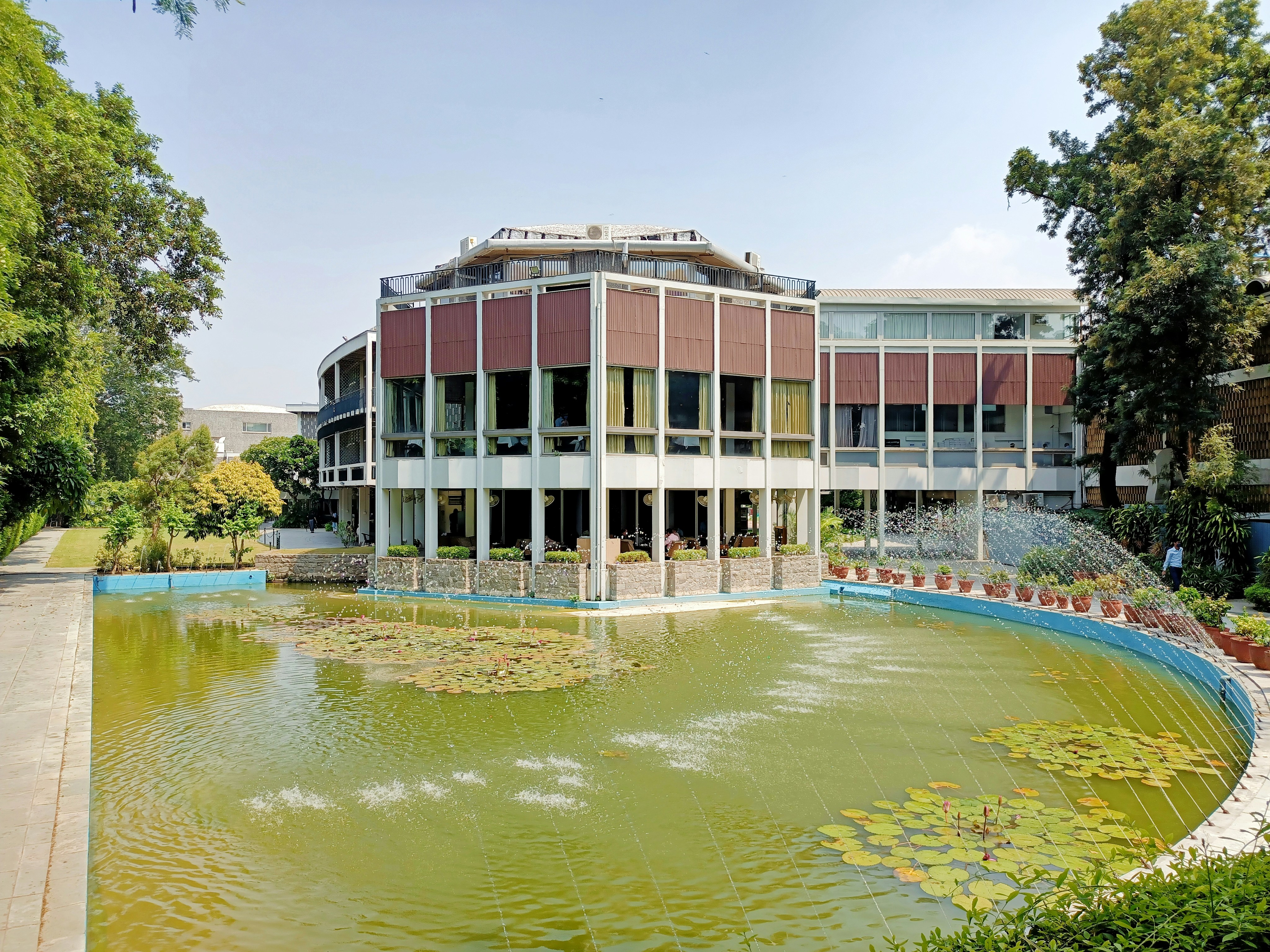 brown concrete building near body of water during daytime