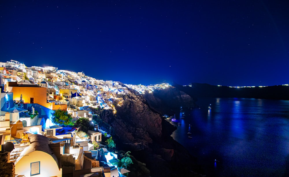 houses near body of water during night time