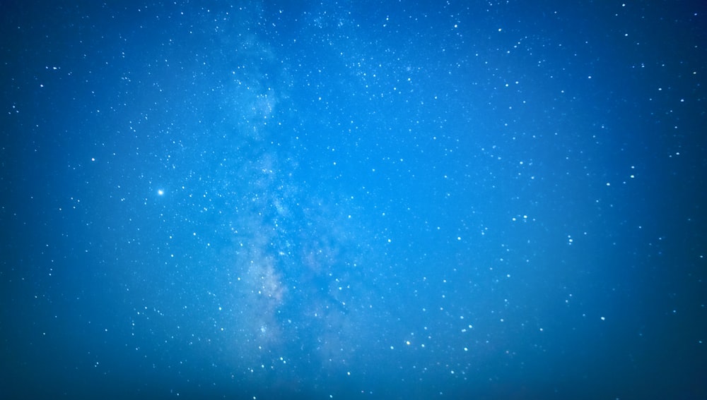 blue and white sky with stars