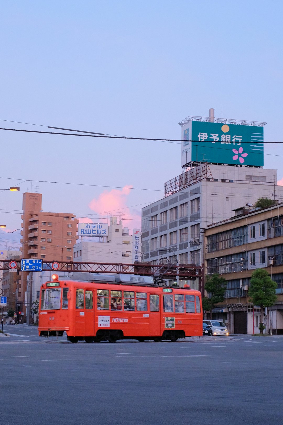 red and white tram on the street