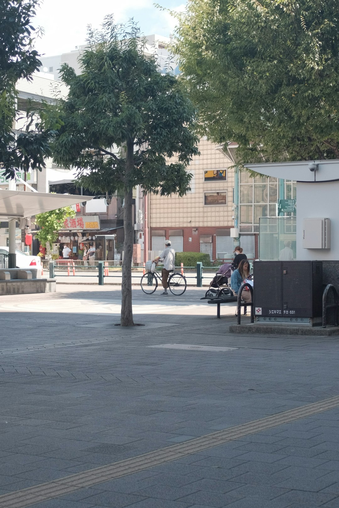 man in black shirt riding bicycle on road during daytime