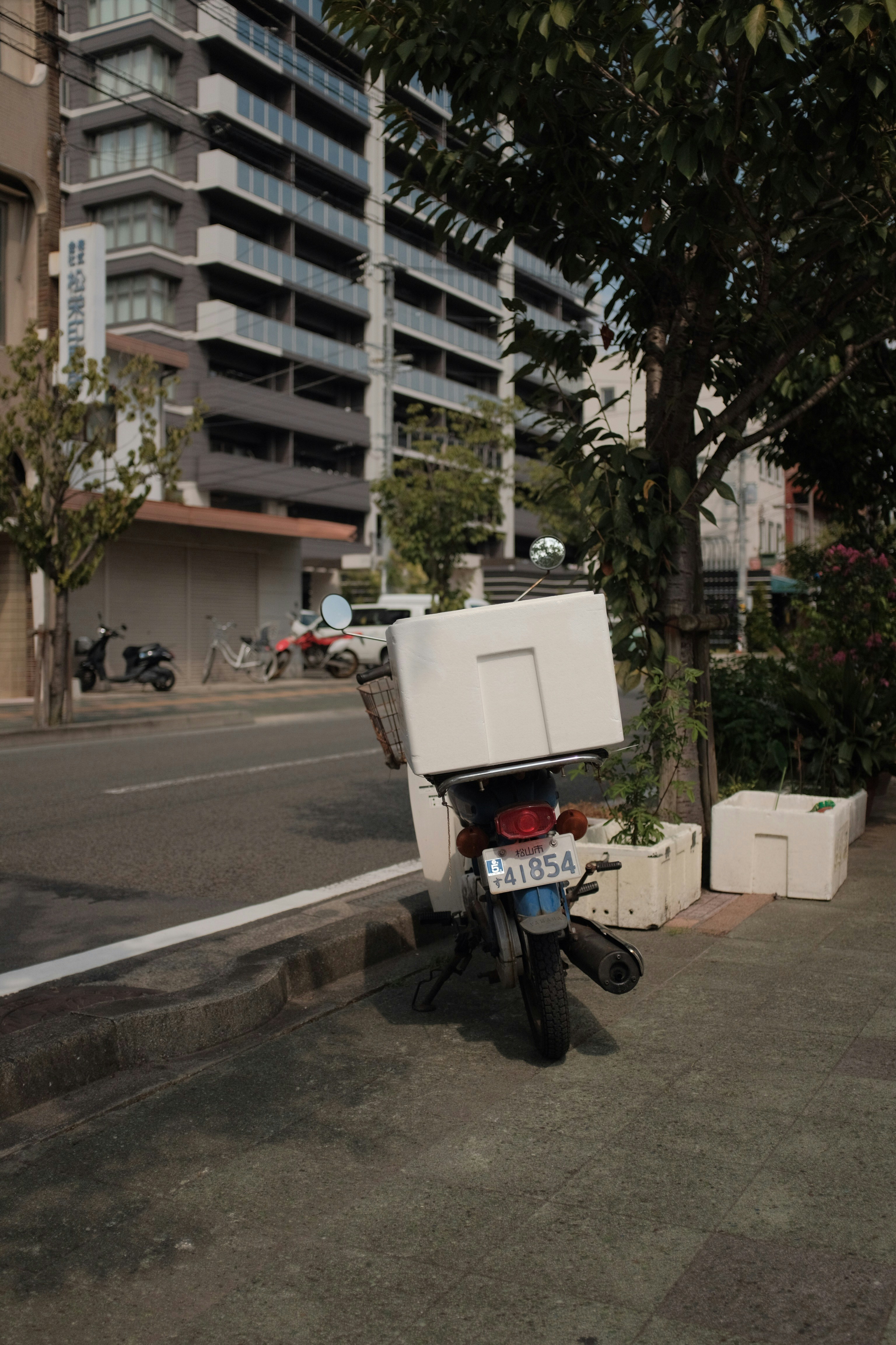 man in black jacket riding on motorcycle on road during daytime