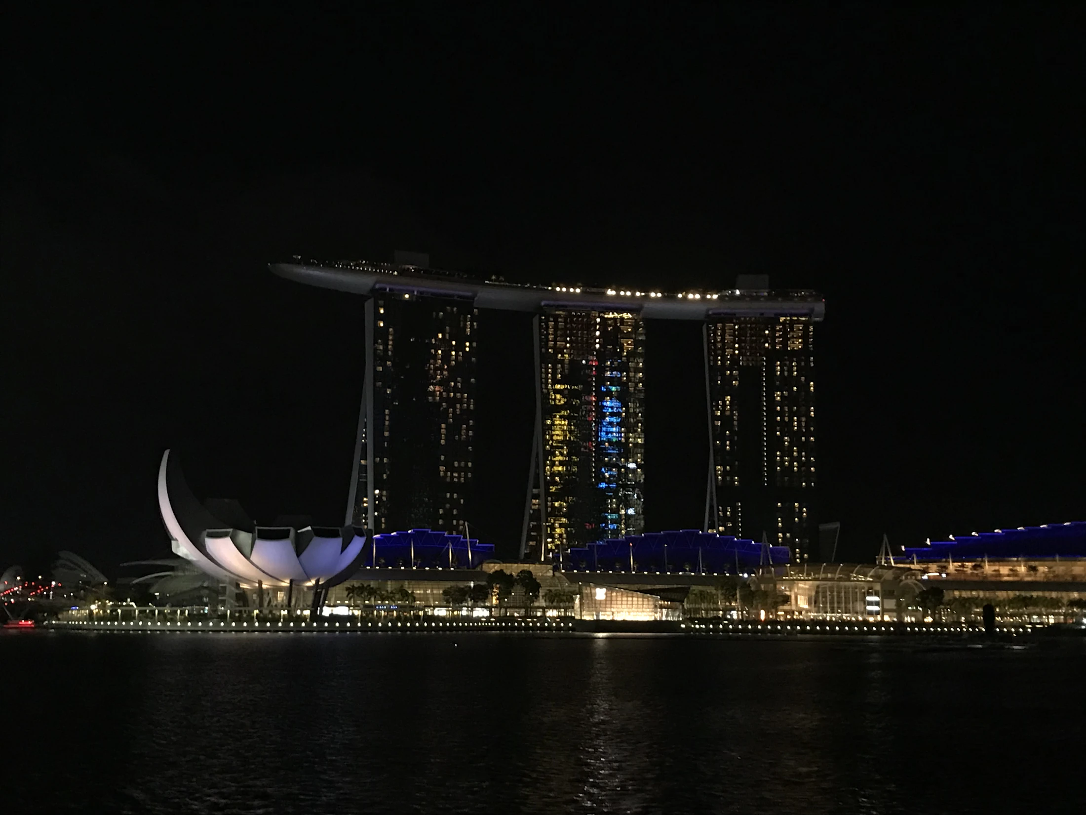 Singapore Marina Bay at night with the lit skyline and Marina Bay Sands