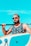man in black and white floral tank top wearing black sunglasses