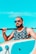 man in black and white floral tank top wearing black sunglasses