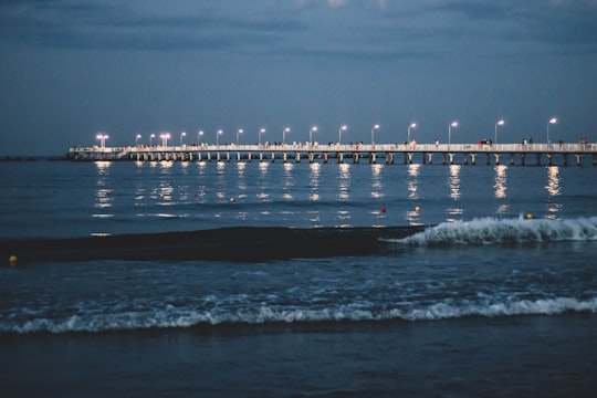 white bridge over the sea during daytime in Mamaia Romania