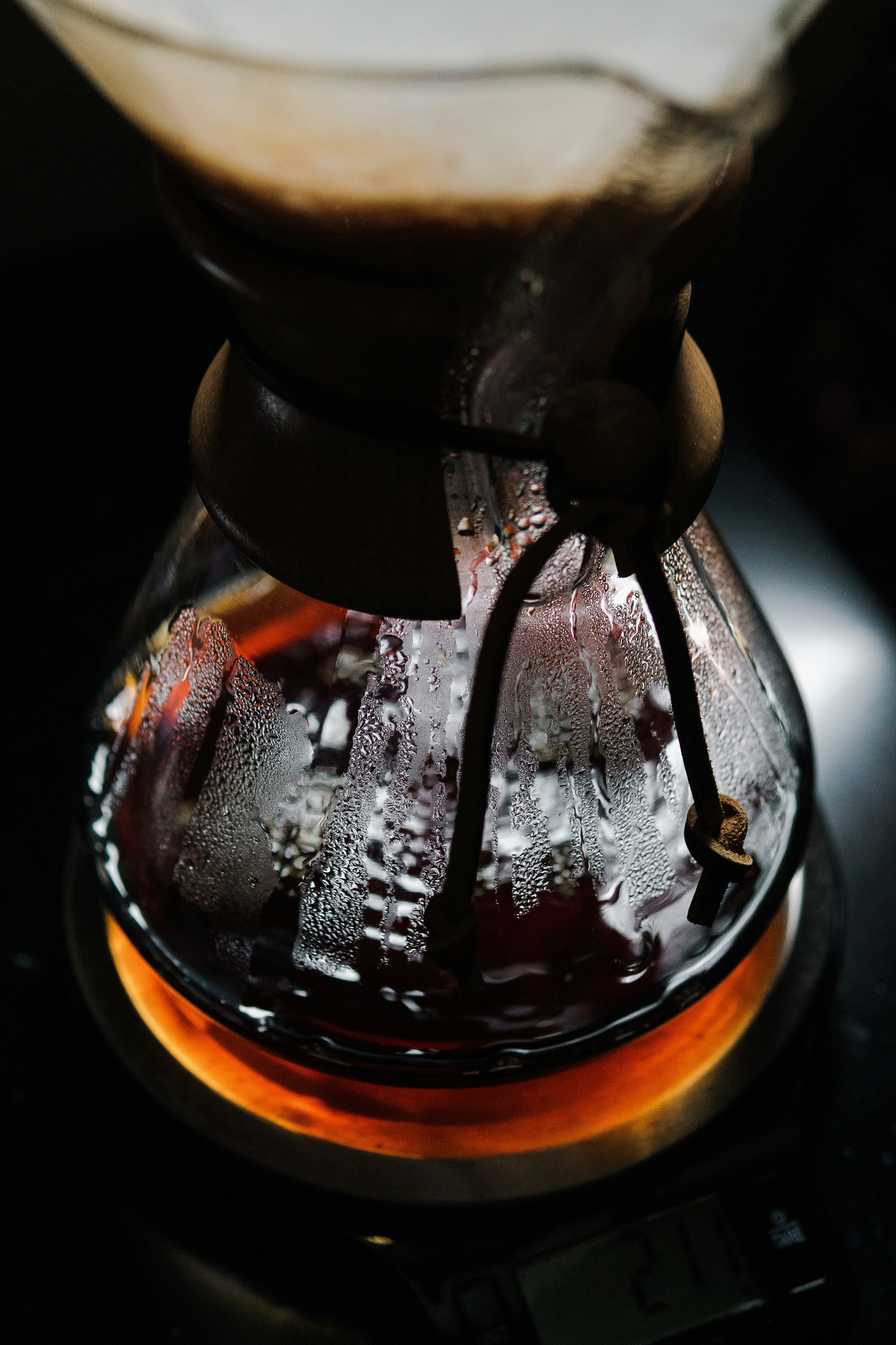 clear glass container with brown liquid