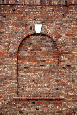 brown brick wall with hole