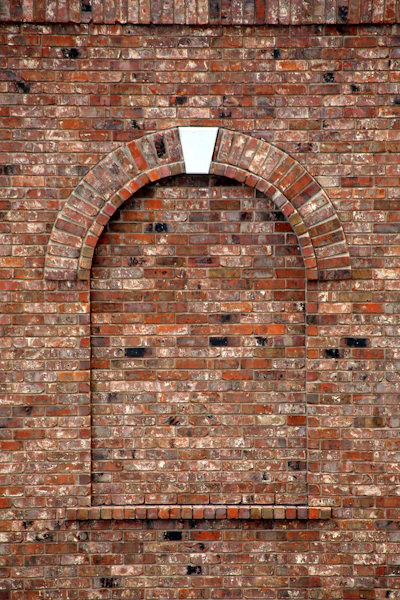 brown brick wall with hole