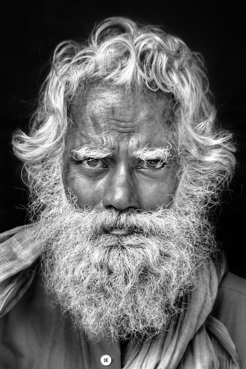 grayscale photo of man with long beard