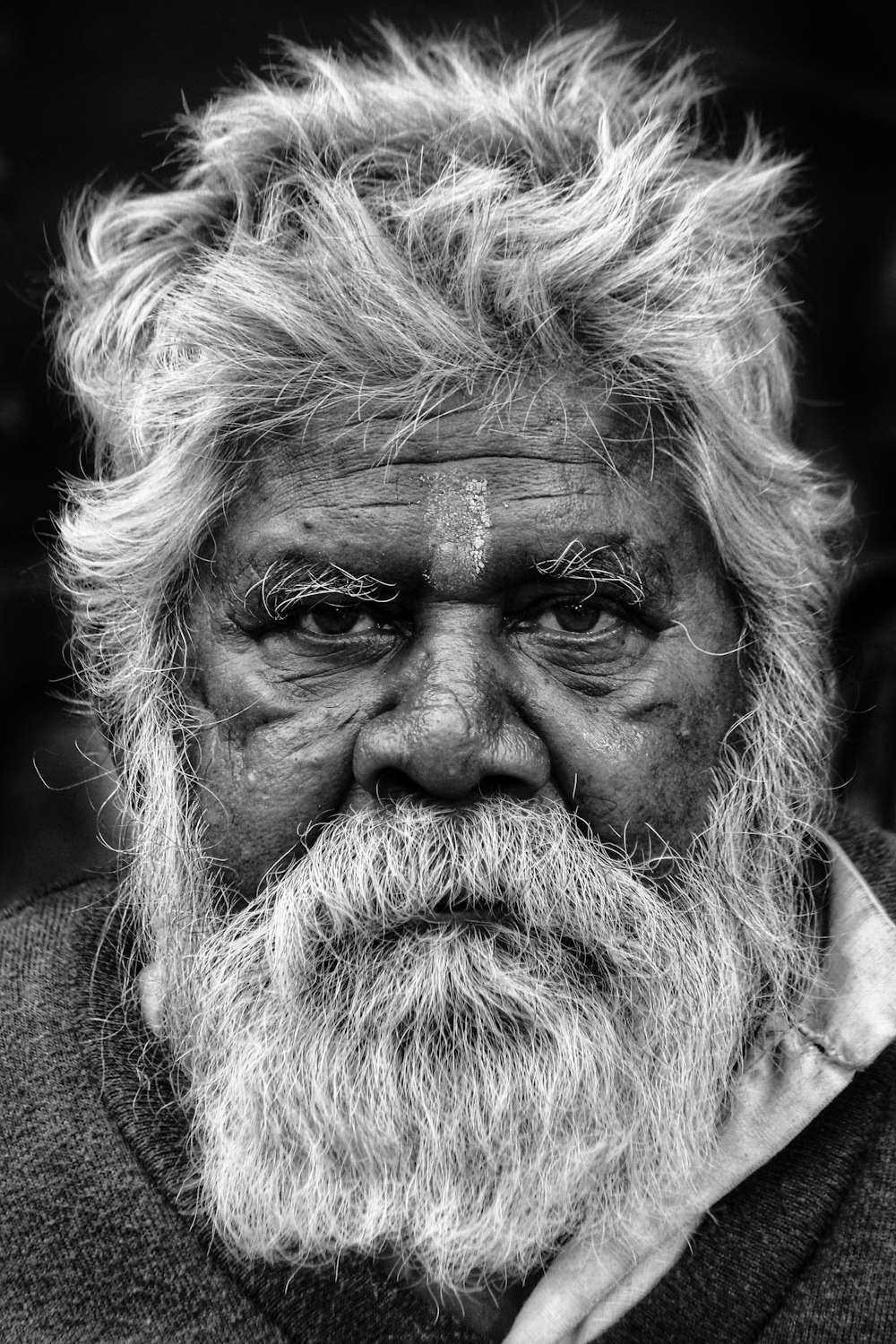 grayscale photo of man in black shirt