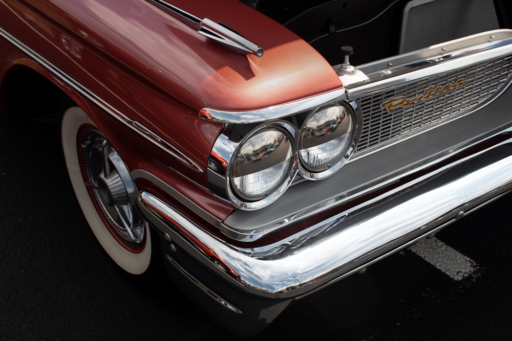 red and silver car in close up photography