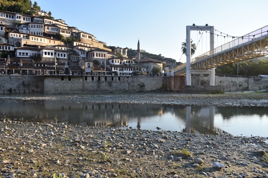 white bridge over river during daytime in Berat Albania