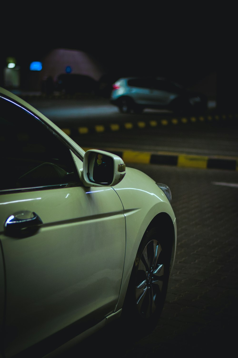 white car on the road during night time