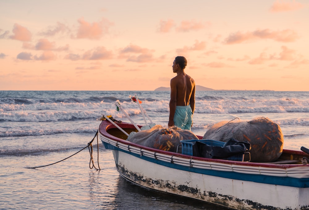 woman in white bikini sitting on brown and white boat on sea during daytime