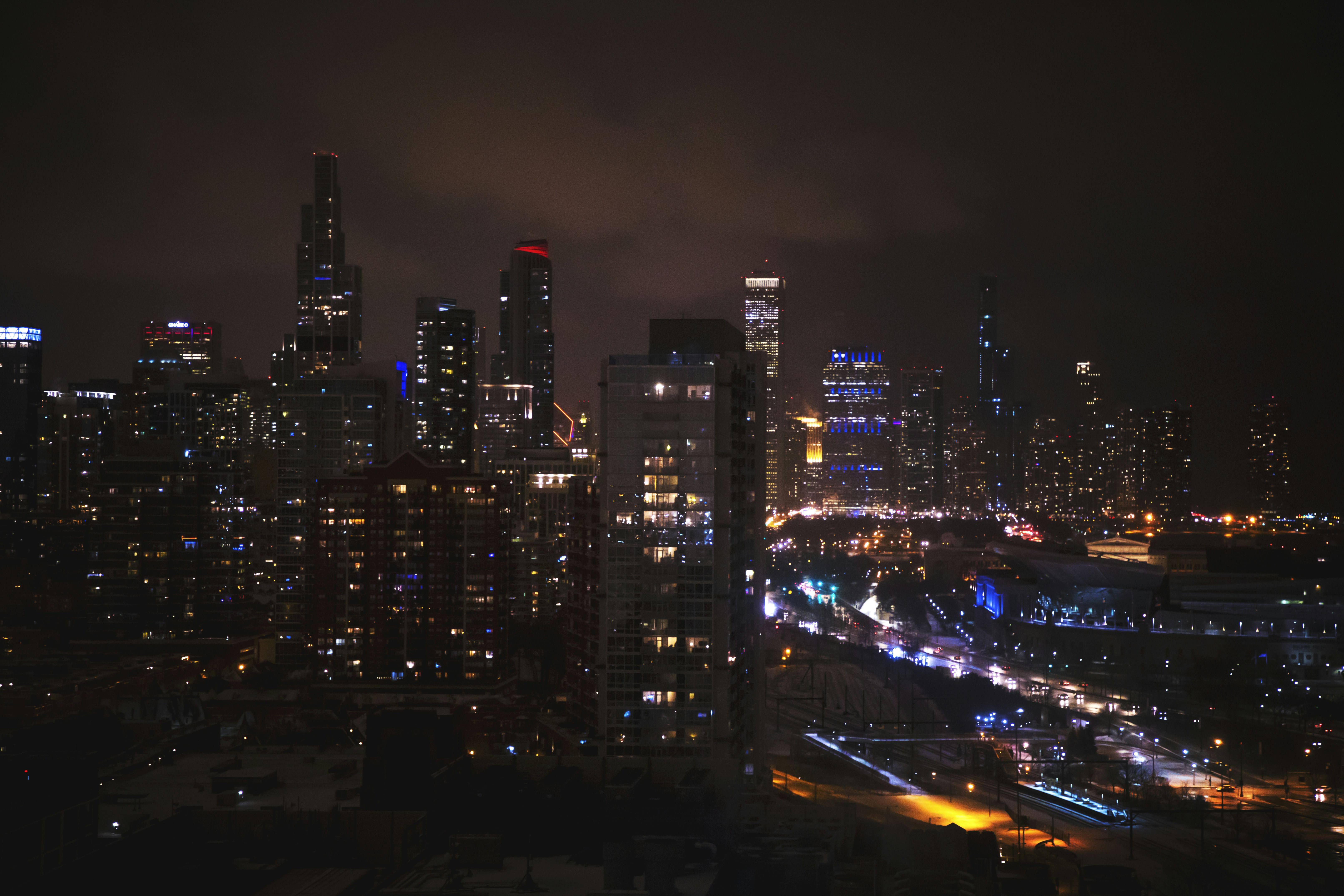 A rooftop bar at dusk overlooking the Chicago skyline - Best Gold Coast pubs
