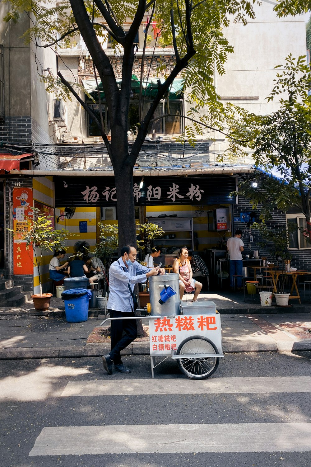 people sitting on bench near building during daytime