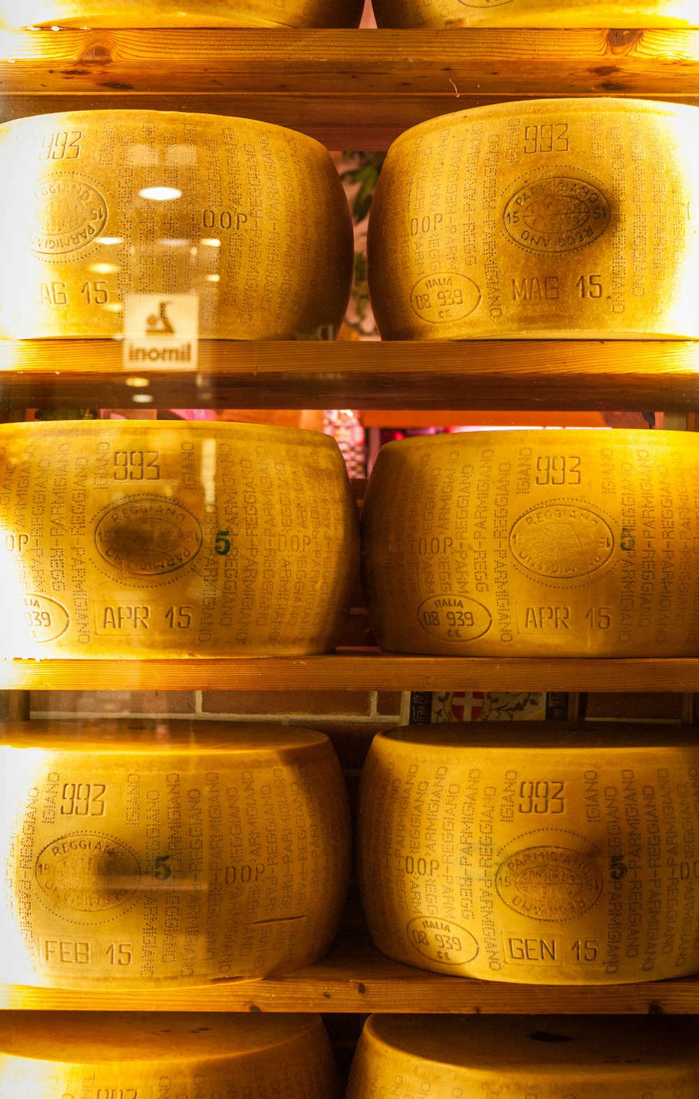 brown ceramic jars on brown wooden shelf