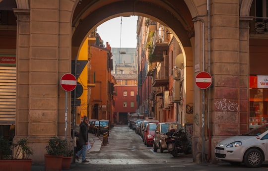 cars parked on the side of the road during daytime in Bologna Italy