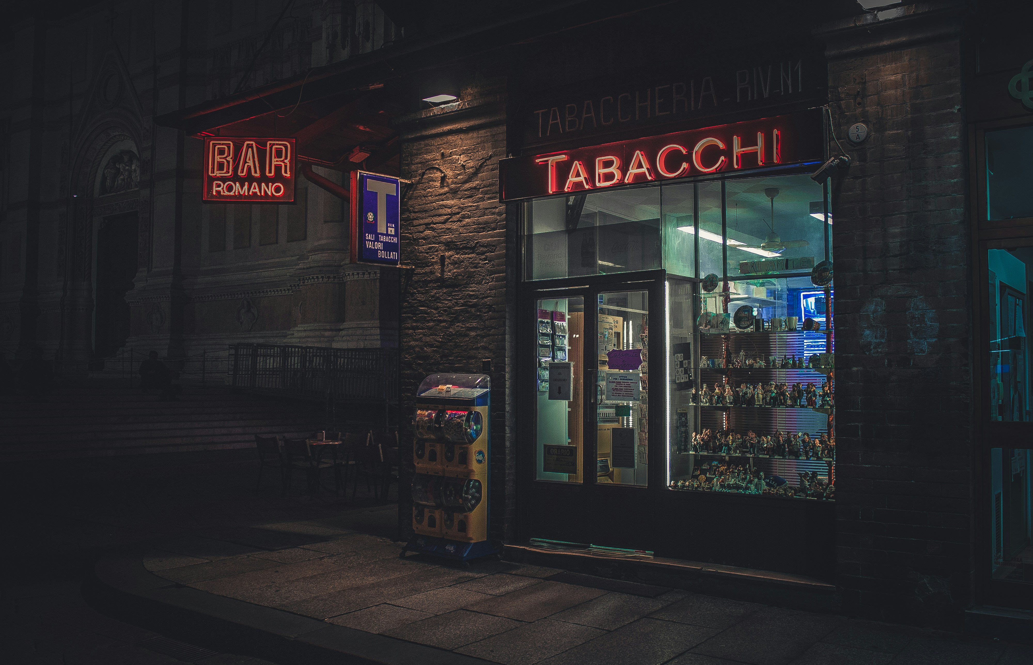 brown and black store front during night time