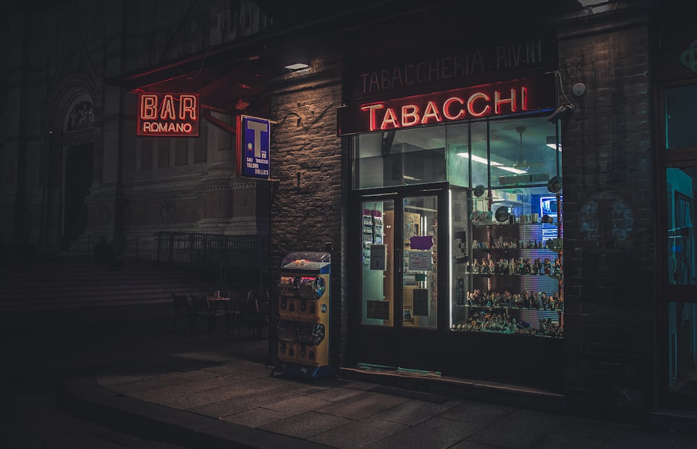 brown and black store front during night time