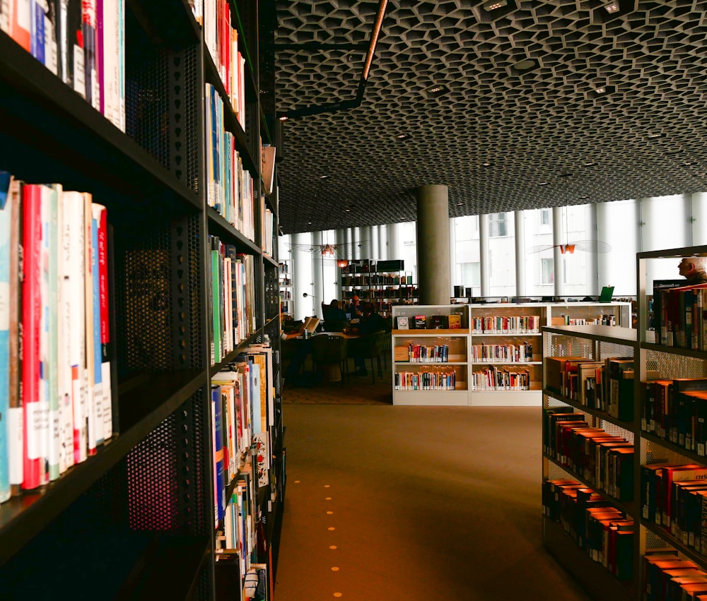 red and white labeled book on shelves