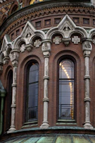 Close-up of refined architectural details featuring textured stone and wrought iron in a historic renovation.
