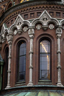 Close-up of refined architectural details featuring textured stone and wrought iron in a historic renovation.