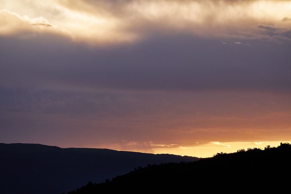 silhouette of mountain during sunset