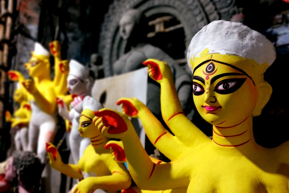 yellow haired woman with red and white face paint