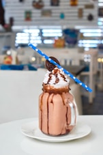 chocolate ice cream on clear glass jar