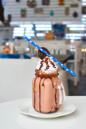 chocolate ice cream on clear glass jar