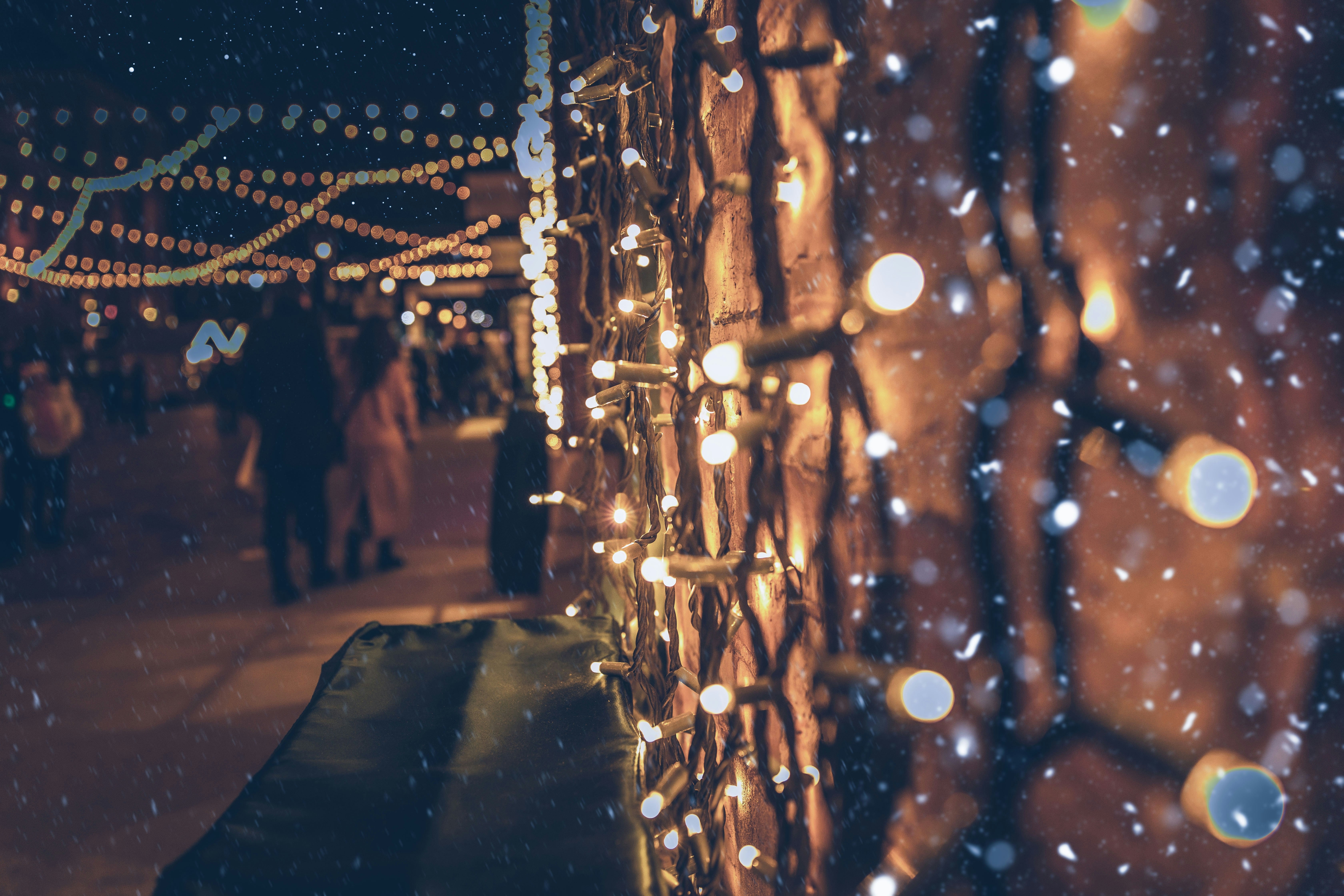 people walking on street during night time