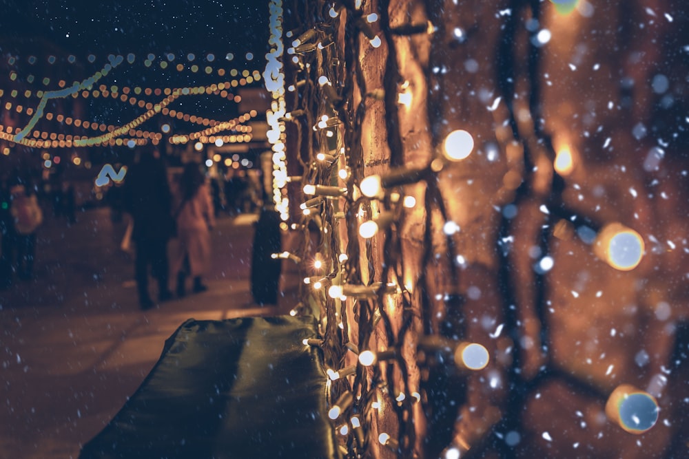 people walking on street during night time