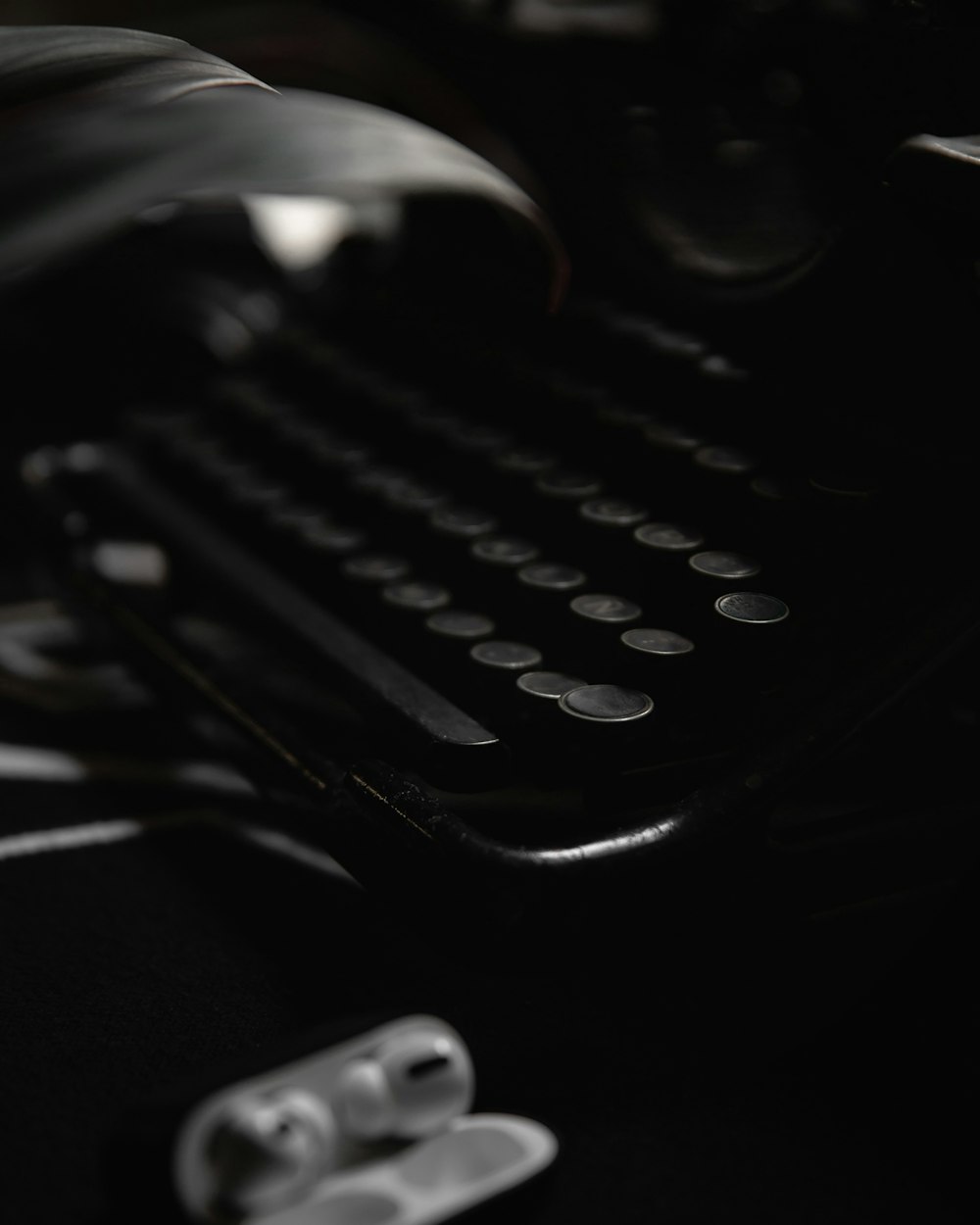 black and silver typewriter on black table