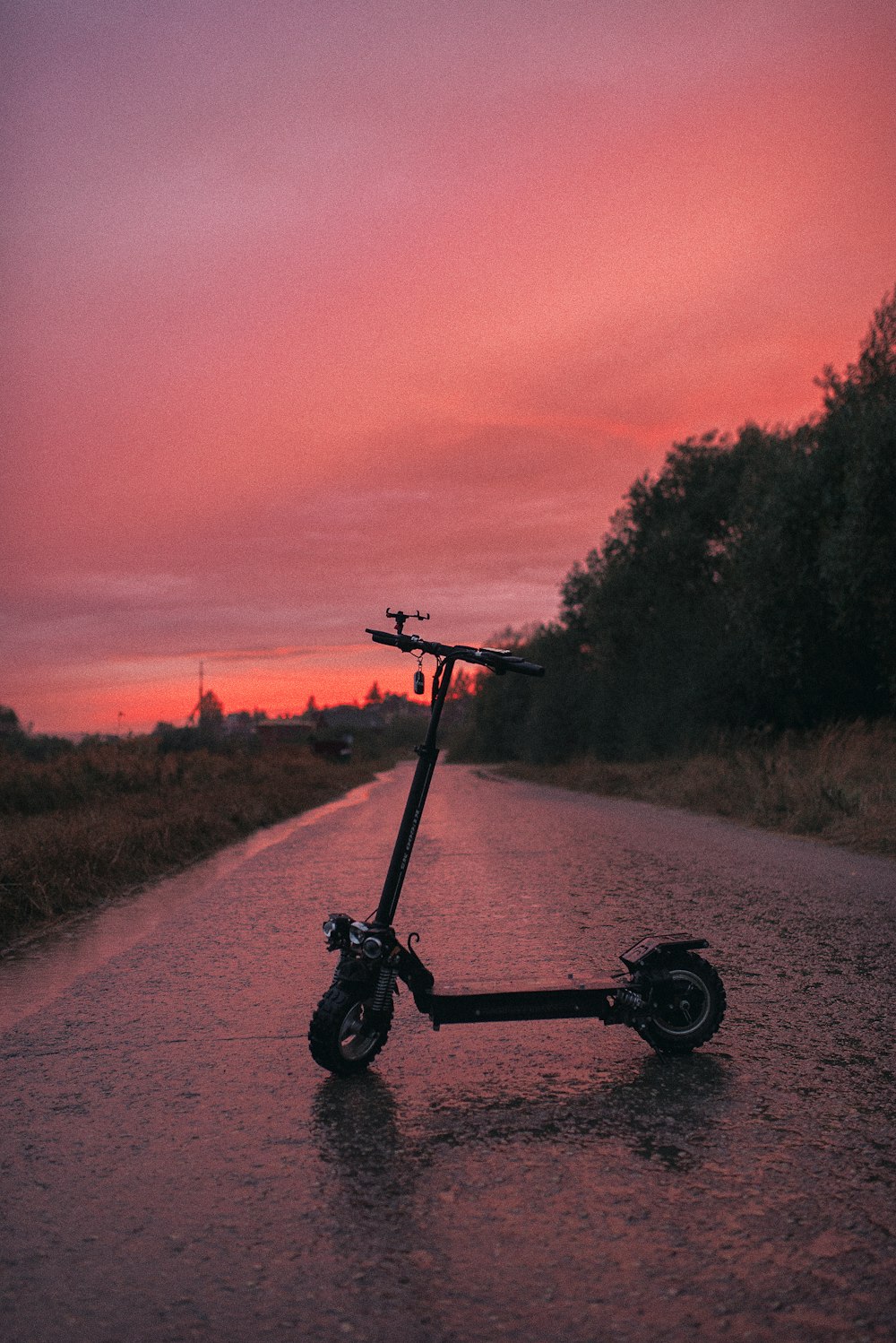 black and gray bicycle on road during sunset