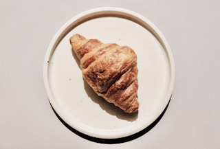 brown bread on white ceramic plate