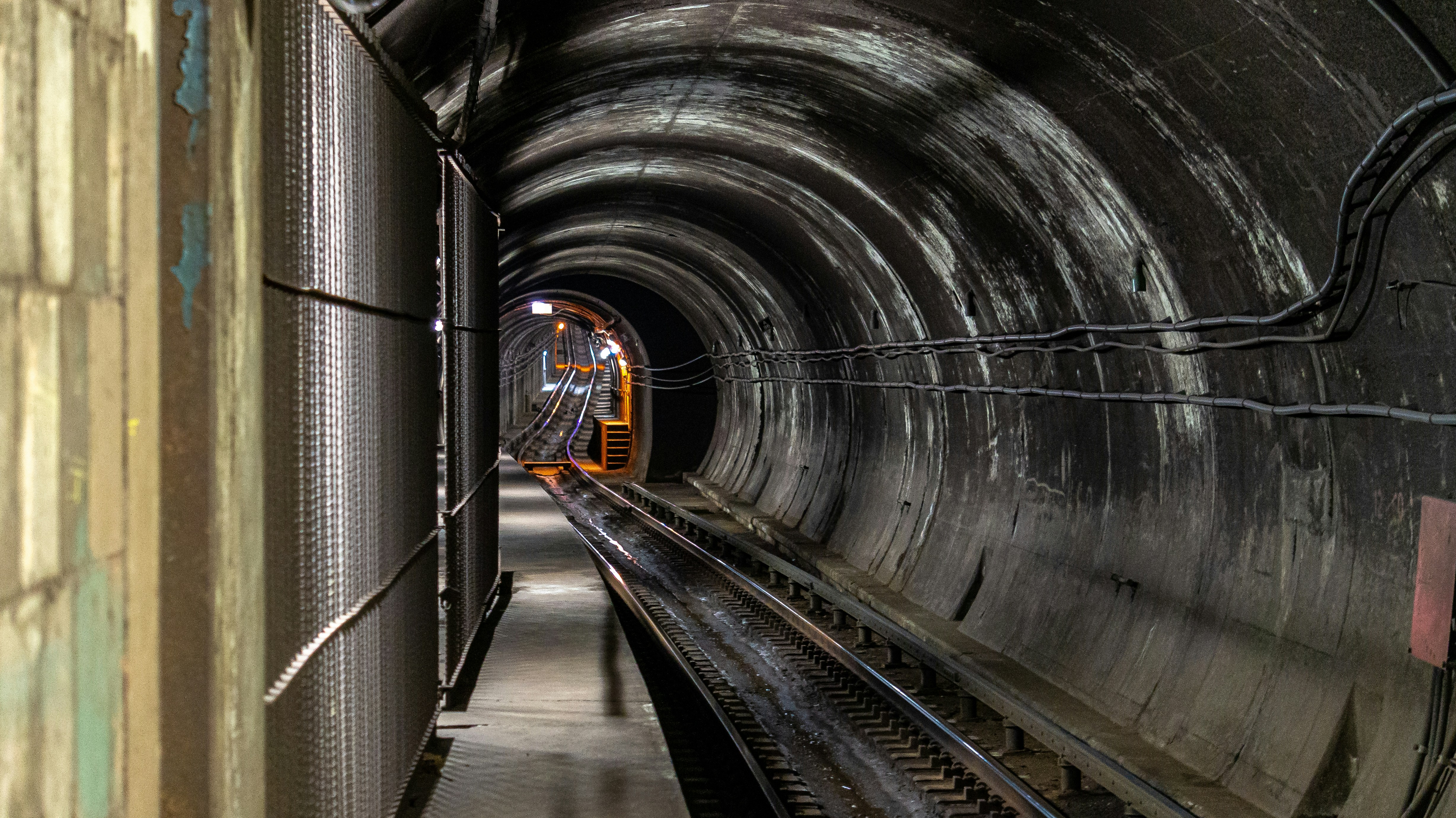 train rail in tunnel during daytime, 