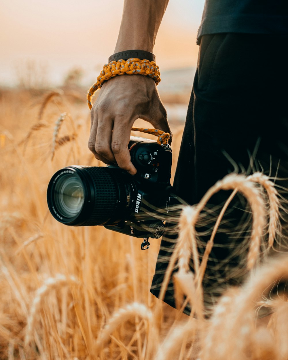 person holding black dslr camera