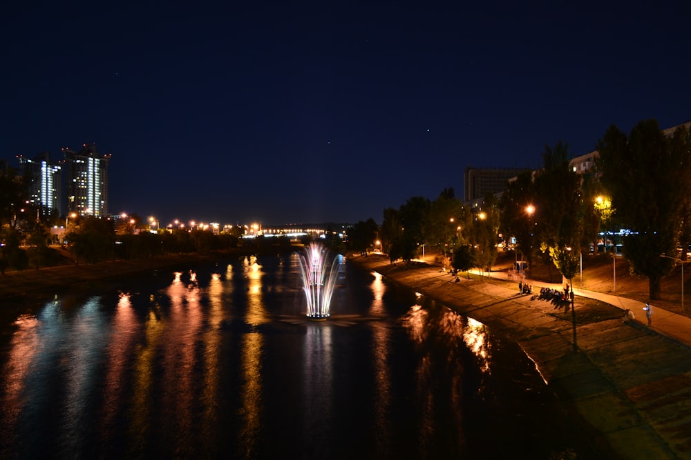 lighted street lights on park during night time