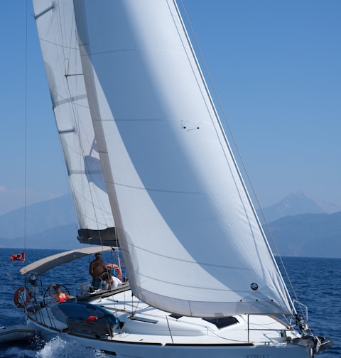 white sailboat on sea during daytime