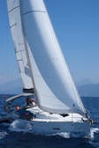 white sailboat on sea during daytime