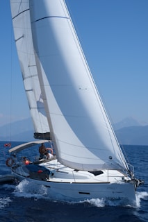 white sailboat on sea during daytime