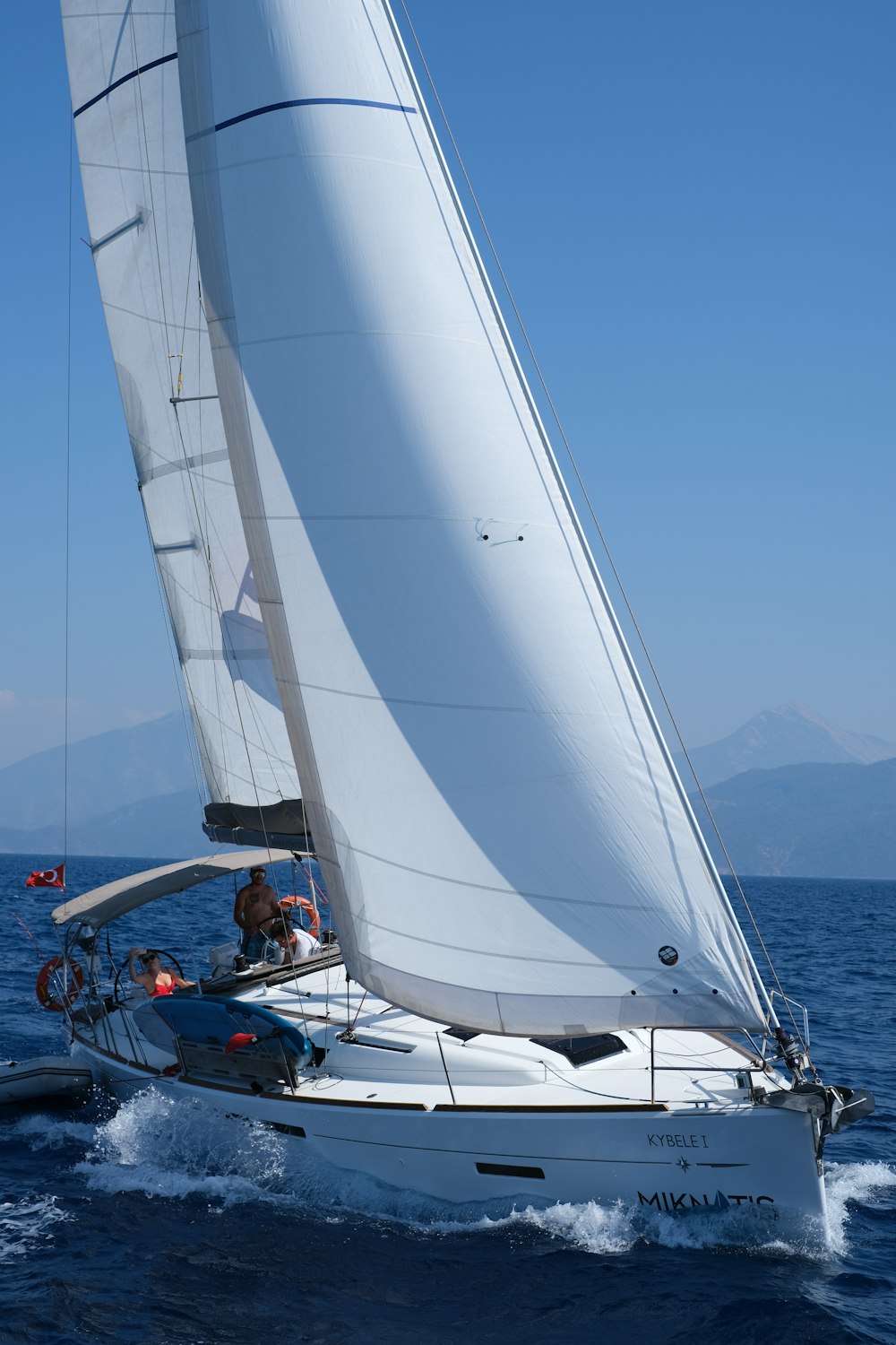 white sailboat on sea during daytime