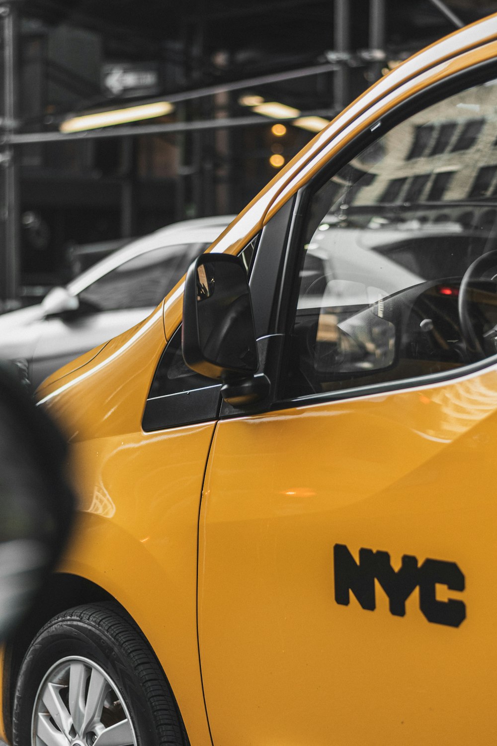 yellow car in the city during daytime