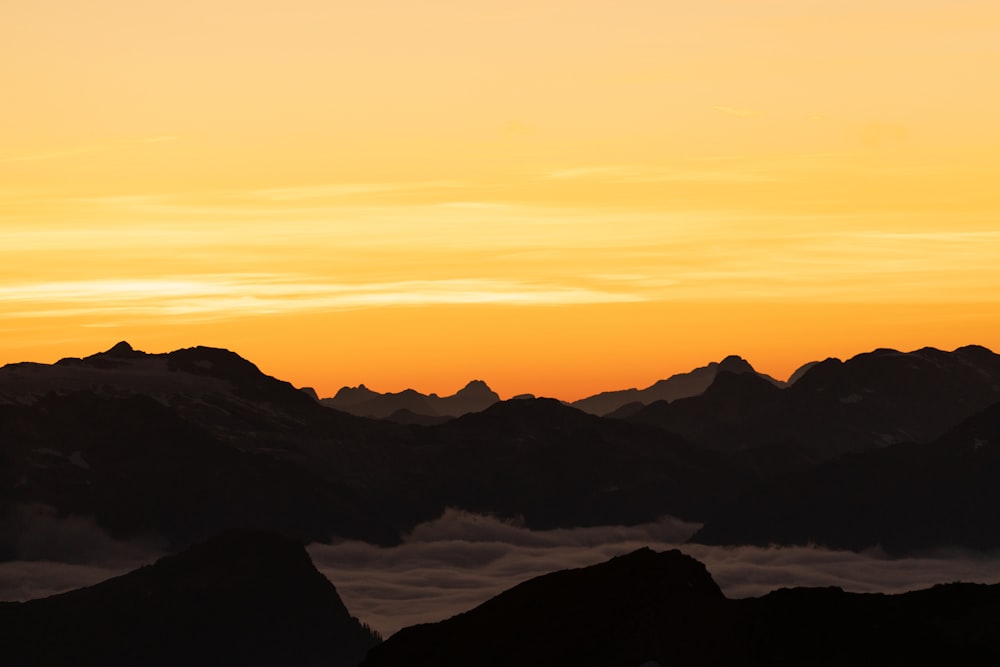 silhouette of mountains during sunset