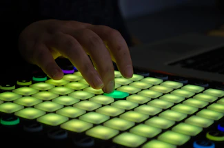 A friendly hand pressing a colorful button on a digital interface