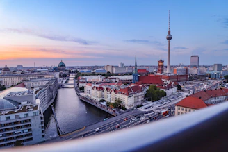 A panoramic view of the Frankfurt skyline at dusk, highlighting the city where flusswert is based.