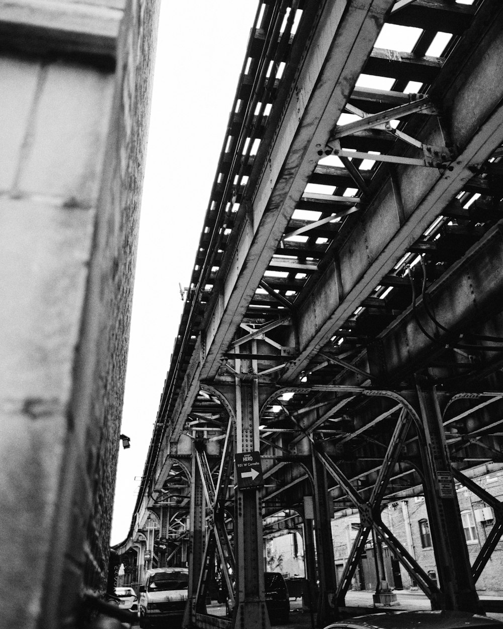 grayscale photo of metal bridge