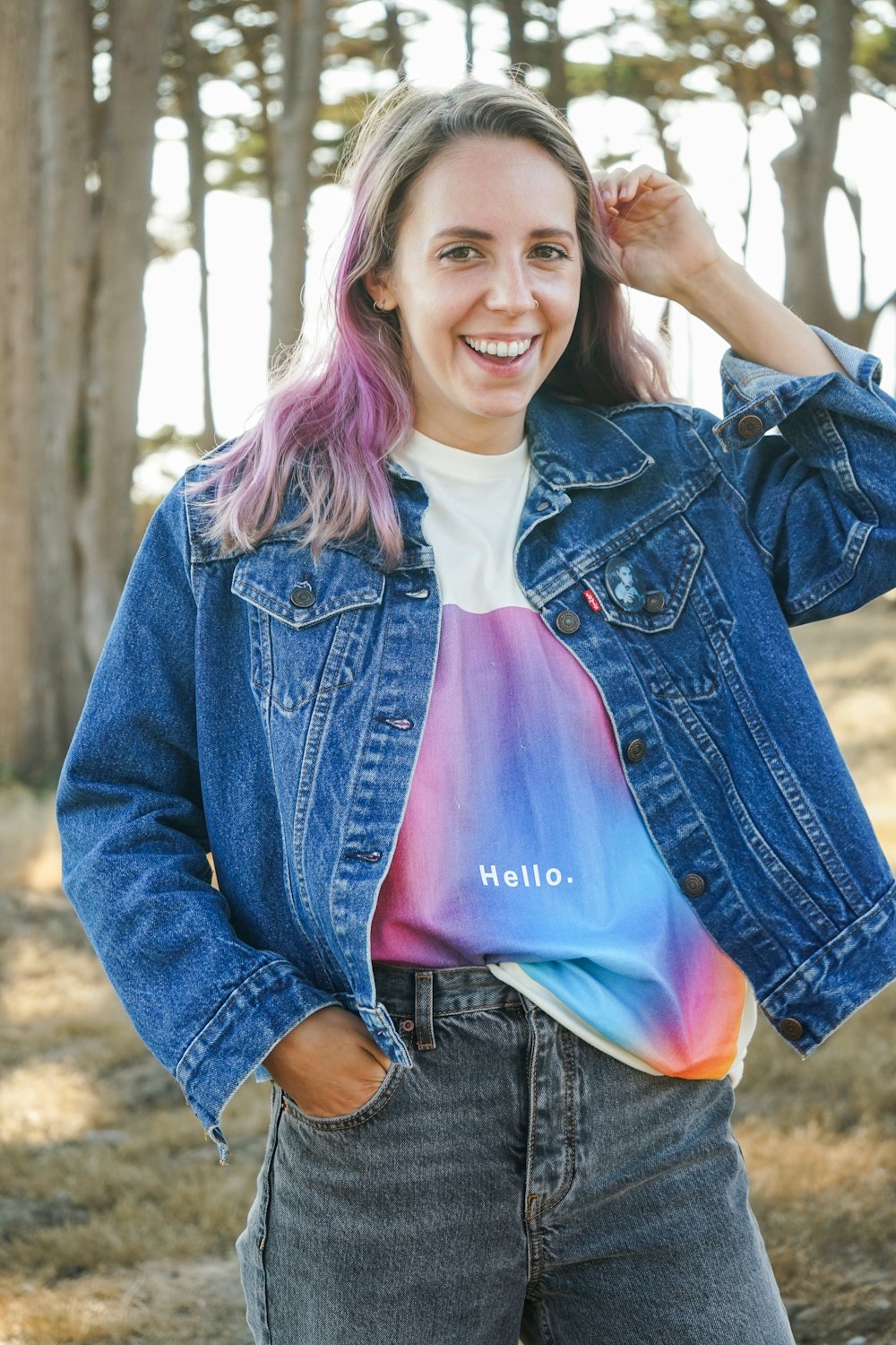 woman in blue denim jacket smiling